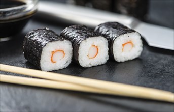 Slate slab with some Sushi (selective focus, close-up shot)