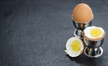 Slate slab with boiled Eggs (selective focus, close-up shot)