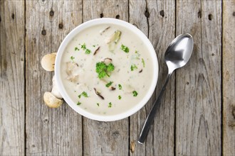 Portion of fresh Porcini Soup close-up shot, selective focus