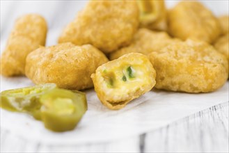 Homemade Cheese Nuggets (with Chilis) on vintage background (selective focus, close-up shot)