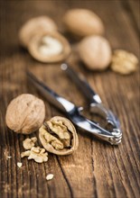 Walnuts on a vintage background as detailed close-up shot (selective focus)