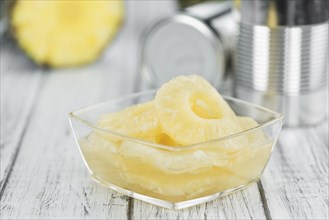 Fresh made Preserved Pineapple Rings on a vintage background as detailed close-up shot