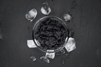 Caviar on a vintage looking slate slab (selective focus)