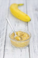 Mashed Bananas on a vintage background as detailed close-up shot (selective focus)