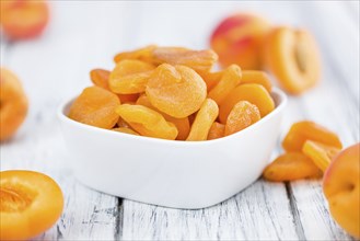 Dried Apricots on a vintage background as detailed close-up shot (selective focus)