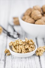 Portion of fresh Walnut kernels (close-up shot, selective focus)