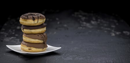 Portion of some Donuts as detailed close-up shot (fresh made, selective focus)