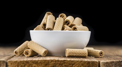 Wafers on an old wooden table as detailed close-up shot, selective focus