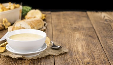 Fresh made Chanterelle Soup on a vintage background as detailed close-up shot