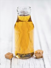 Portion of fresh Caramel Sirup (close-up shot, selective focus)