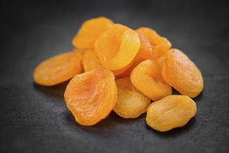 Dried Apricots on a vintage background as detailed close-up shot (selective focus)