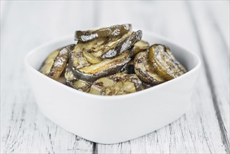 Homemade Antipasti (Grilled Zucchinis) on vintage background (selective focus, close-up shot)