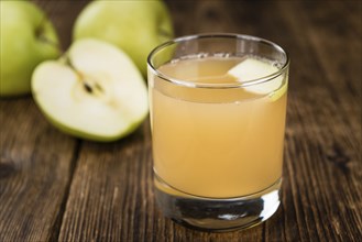 Fresh made Juice (apple) on a vintage background (close-up shot)