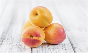 Apricots on a vintage background as detailed close-up shot (selective focus)