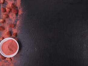 Some Instant Strawberries on a vintage slate slab, selective focus