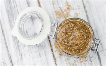 Fresh made German Cuisine (sweet Mustard) on a vintage background (close-up shot)