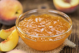 Peach Jam on a vintage background as detailed close-up shot, selective focus