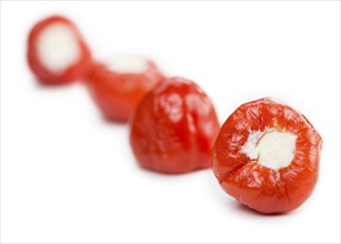 Fresh made Red Pepper (stuffed with cheese) isolated on white background (close-up shot)