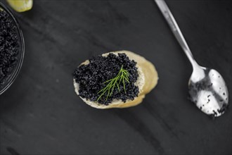 Portion of fresh Black Caviar (selective focus, close-up shot)