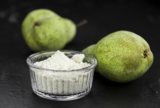 Fresh made Pear powder on a slate slab (close-up shot, selective focus)