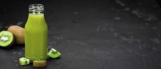 Fresh made Kiwi Smoothie (selective focus) on a vintage looking background