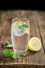 Lemonade on a vintage background as detailed close-up shot (selective focus)