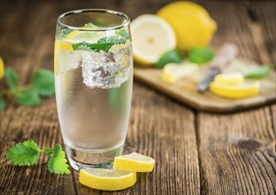 Lemonade on a vintage background as detailed close-up shot (selective focus)