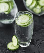 Some fresh Cucumber Water on a vintage slate slab, selective focus, close-up shot