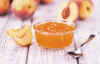 Peach Jam on a vintage background as detailed close-up shot, selective focus