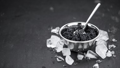 Caviar on a vintage looking slate slab (selective focus)