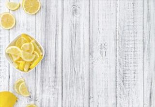 Fresh made Lemon (sliced) on a vintage background (close-up shot)