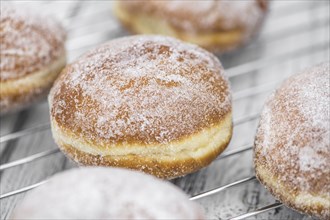 Portion of Berliner Doughnuts as detailed close-up shot, selective focus