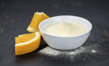 Portion of fresh made Orange Powder as detailed close-up shot (selective focus)
