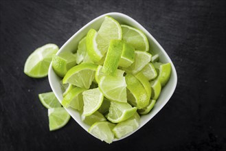 Portion of fresh Lime Slices (close-up shot, selective focus)