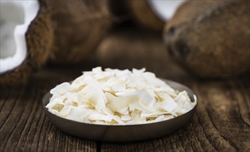 Fresh Coconut Flakes as detailed close-up shot (selective focus)