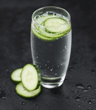 Some fresh Cucumber Water on a vintage slate slab, selective focus, close-up shot