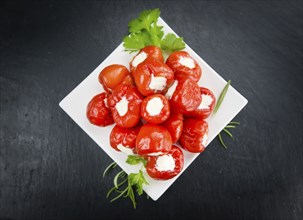 Homemade Filled Pimientos on vintage background (selective focus, close-up shot)