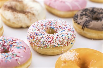 Portion of some Donuts as detailed close-up shot (fresh made, selective focus)