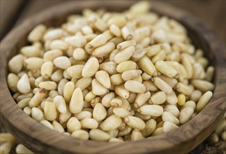 Pine Nuts on a vintage background as detailed close-up shot (selective focus)