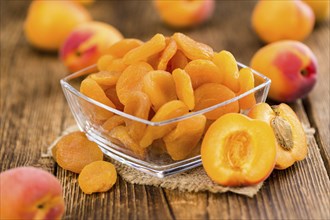 Dried Apricots on a vintage background as detailed close-up shot (selective focus)