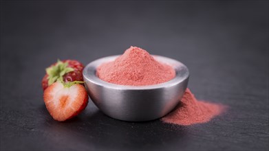 Some Instant Strawberries on a vintage slate slab, selective focus