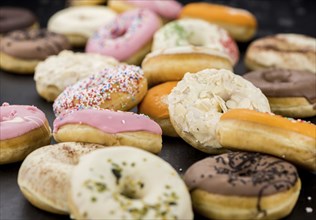 Portion of some Donuts as detailed close-up shot (fresh made, selective focus)