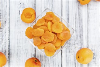 Dried Apricots on a vintage background as detailed close-up shot (selective focus)