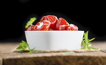 Homemade Filled Pimientos on vintage background (selective focus, close-up shot)