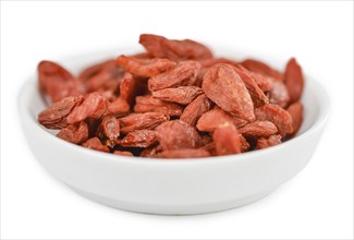 Goji Berries (dried) isolated on white background (selective focus, close-up shot)