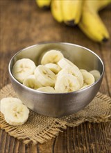 Sliced Bananas on a vintage background as detailed close-up shot, selective focus