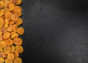Portion of fresh Dried Apricots (close-up shot, selective focus)
