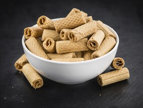 Portion of Sweet Wafers on a rustic slate slab, selective focus, close-up shot