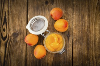 Pickled Apricots on a vintage background as detailed close-up shot (selective focus)