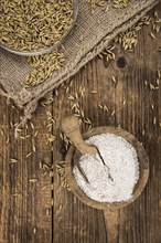 Portion of fresh Oat Flour on an old wooden table